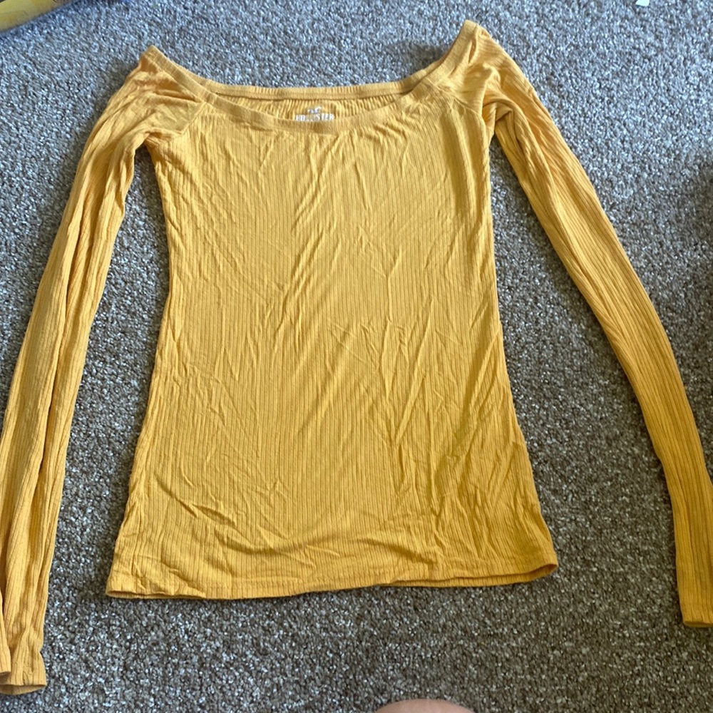 Yellow, tight fitting, off the shoulder shirt
